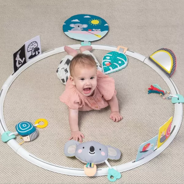 Taf Toys All Around Me Activity Hoop  Developmental Hoop Prefect for Newborns and up with 24 Developmental Activities Designed to Promote Babys Senses Motor Skills and Cognitive DevelopmentGreen