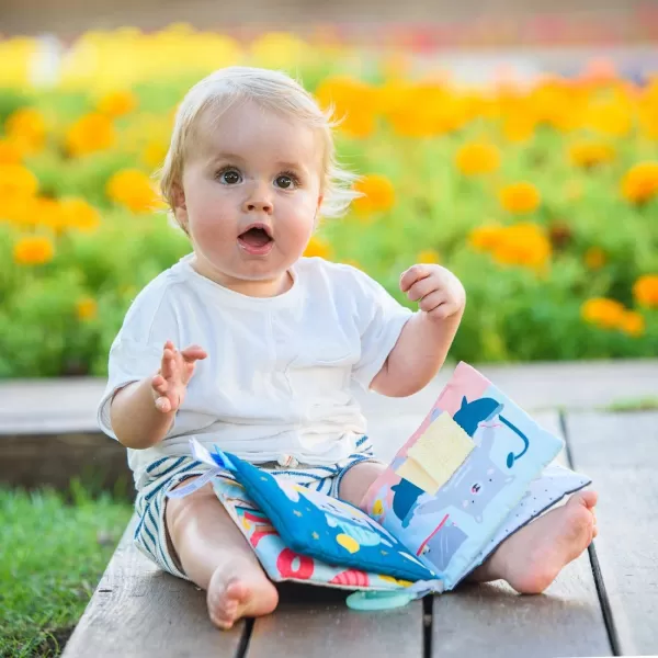 Taf Toys What Does Paul Wear Book Interactive Soft Pages Sensory Book Early Education Crinkle Activity Book with Textures and Baby Safe Mirror OnTheGo Parent and Babys Travel Companion