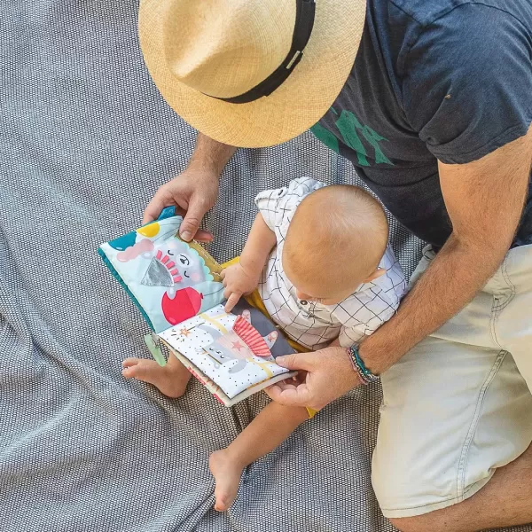 Taf Toys What Does Paul Wear Book Interactive Soft Pages Sensory Book Early Education Crinkle Activity Book with Textures and Baby Safe Mirror OnTheGo Parent and Babys Travel Companion