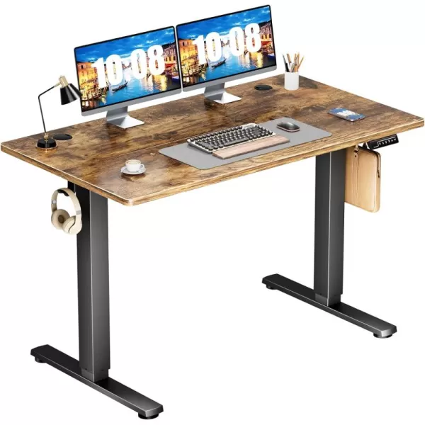 Sweetcrispy Height Adjustable Electric Ergonomic Design Sit Desk with Splice Board Standing Table Black FrameRustic Brown Desktop for Home Office