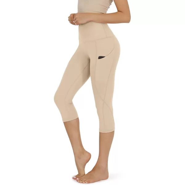 imageODODOS Womens High Waisted Yoga Capris with Pockets Tummy Control Non See Through Workout Athletic Running Capri LeggingsBeige