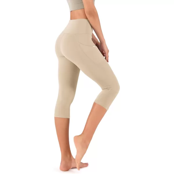 imageODODOS Womens High Waisted Yoga Capris with Pockets Tummy Control Non See Through Workout Athletic Running Capri LeggingsBeige