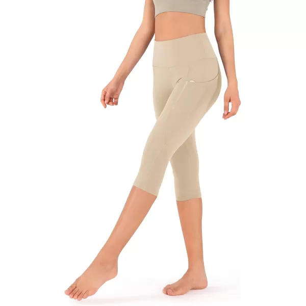 imageODODOS Womens High Waisted Yoga Capris with Pockets Tummy Control Non See Through Workout Athletic Running Capri LeggingsBeige