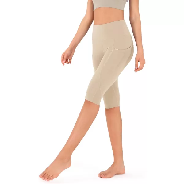 imageODODOS Womens High Waisted Yoga Capris with Pockets Tummy Control Non See Through Workout Athletic Running Capri LeggingsBeige