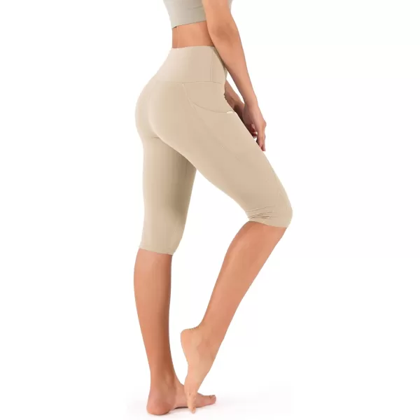 imageODODOS Womens High Waisted Yoga Capris with Pockets Tummy Control Non See Through Workout Athletic Running Capri LeggingsBeige