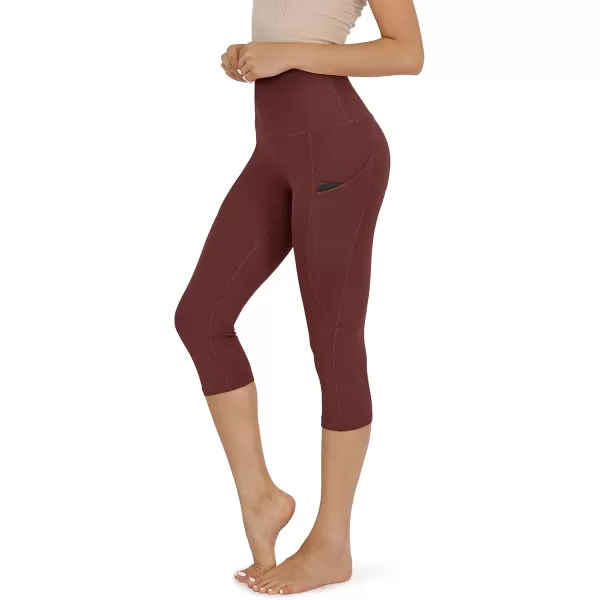 imageODODOS Womens High Waisted Yoga Capris with Pockets Tummy Control Non See Through Workout Athletic Running Capri LeggingsBurgundy