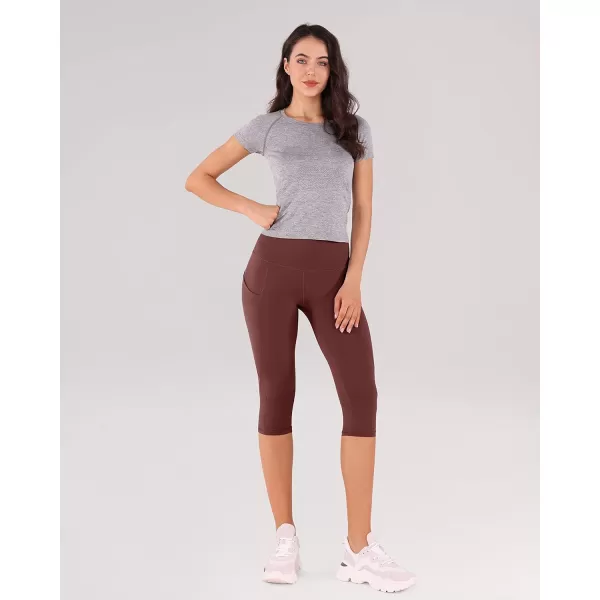imageODODOS Womens High Waisted Yoga Capris with Pockets Tummy Control Non See Through Workout Athletic Running Capri LeggingsBurgundy