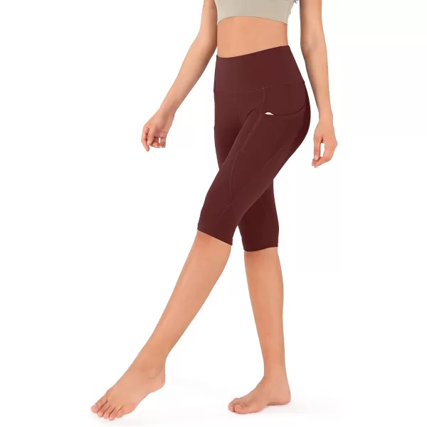 imageODODOS Womens High Waisted Yoga Capris with Pockets Tummy Control Non See Through Workout Athletic Running Capri LeggingsBurgundy