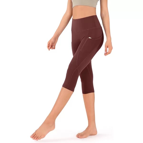 imageODODOS Womens High Waisted Yoga Capris with Pockets Tummy Control Non See Through Workout Athletic Running Capri LeggingsBurgundy