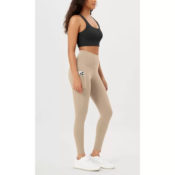 imageODODOS Womens High Waisted Yoga Leggings with Pockets Tummy Control Non See Through Workout Athletic Running Yoga PantsBeige