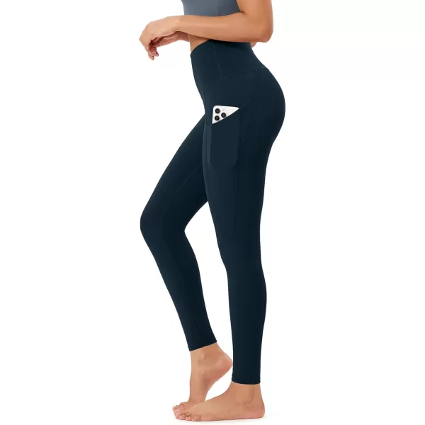 imageODODOS Womens High Waisted Yoga Leggings with Pockets Tummy Control Non See Through Workout Athletic Running Yoga PantsDeep Navy