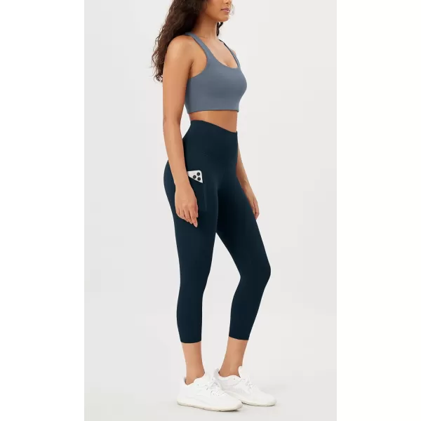 imageODODOS Womens High Waisted Yoga Leggings with Pockets Tummy Control Non See Through Workout Athletic Running Yoga PantsDeep Navy