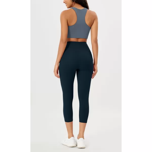 imageODODOS Womens High Waisted Yoga Leggings with Pockets Tummy Control Non See Through Workout Athletic Running Yoga PantsDeep Navy