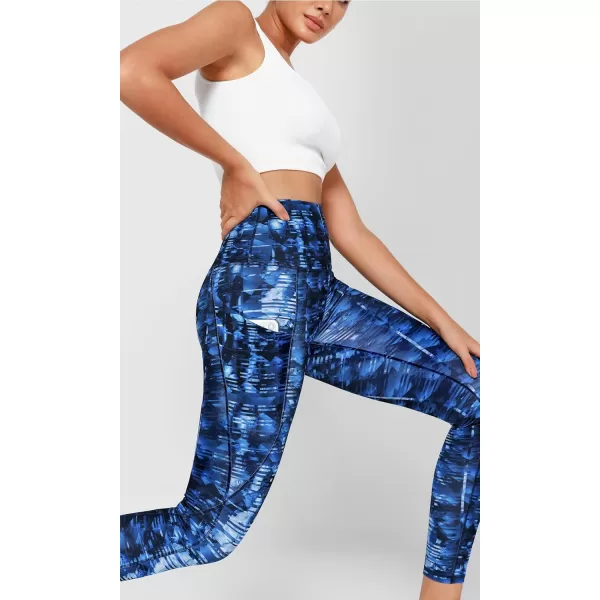 imageODODOS Womens High Waisted Yoga Leggings with Pockets Tummy Control Non See Through Workout Athletic Running Yoga PantsIndigo