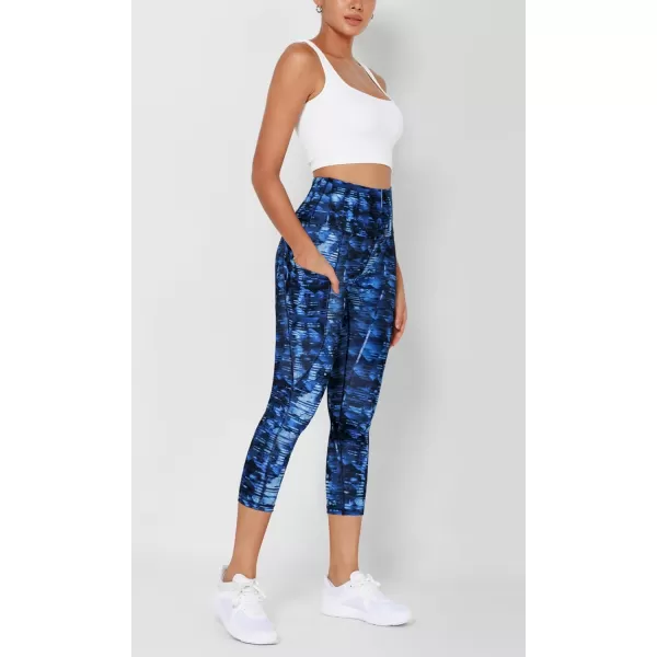 imageODODOS Womens High Waisted Yoga Leggings with Pockets Tummy Control Non See Through Workout Athletic Running Yoga PantsIndigo
