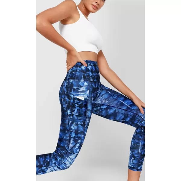imageODODOS Womens High Waisted Yoga Leggings with Pockets Tummy Control Non See Through Workout Athletic Running Yoga PantsIndigo