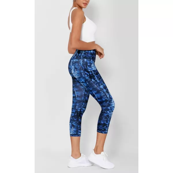 imageODODOS Womens High Waisted Yoga Leggings with Pockets Tummy Control Non See Through Workout Athletic Running Yoga PantsIndigo