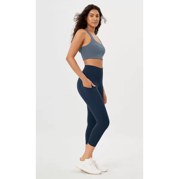 imageODODOS Womens High Waisted Yoga Leggings with Pockets Tummy Control Non See Through Workout Athletic Running Yoga PantsNavy