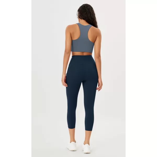 imageODODOS Womens High Waisted Yoga Leggings with Pockets Tummy Control Non See Through Workout Athletic Running Yoga PantsNavy