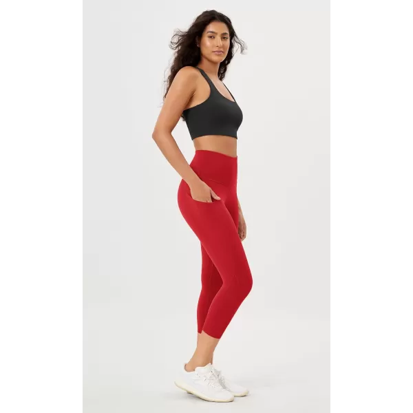 imageODODOS Womens High Waisted Yoga Leggings with Pockets Tummy Control Non See Through Workout Athletic Running Yoga PantsRed