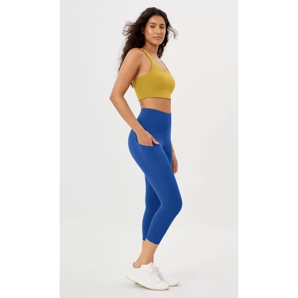 imageODODOS Womens High Waisted Yoga Leggings with Pockets Tummy Control Non See Through Workout Athletic Running Yoga PantsRoyal Blue