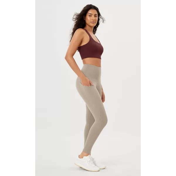 imageODODOS Womens High Waisted Yoga Leggings with Pockets Tummy Control Non See Through Workout Athletic Running Yoga PantsShaker Beige