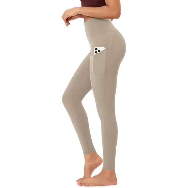 imageODODOS Womens High Waisted Yoga Leggings with Pockets Tummy Control Non See Through Workout Athletic Running Yoga PantsShaker Beige