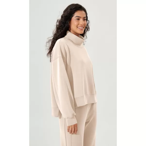 imageODODOS Modal Soft Split Hem Turtleneck Sweatshirts for Women Long Sleeve Casual Pullover TopBeige