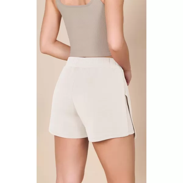 imageODODOS Modal Soft Wrap Mini Skorts with Pocket for Women High Waist Asymmetrical Hem Relaxed ShortsIvory
