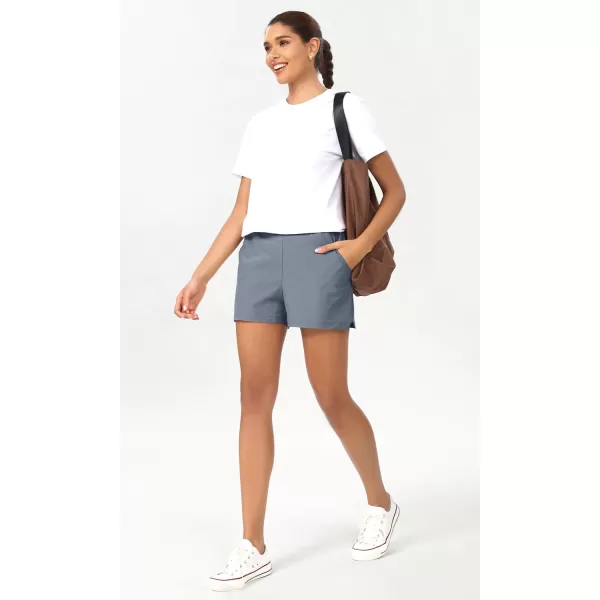 imageODODOS Stretch Woven Relaxed Shorts for Women Elastic High Waist Summer Lightweight Casual Shorts with PocketsBlue