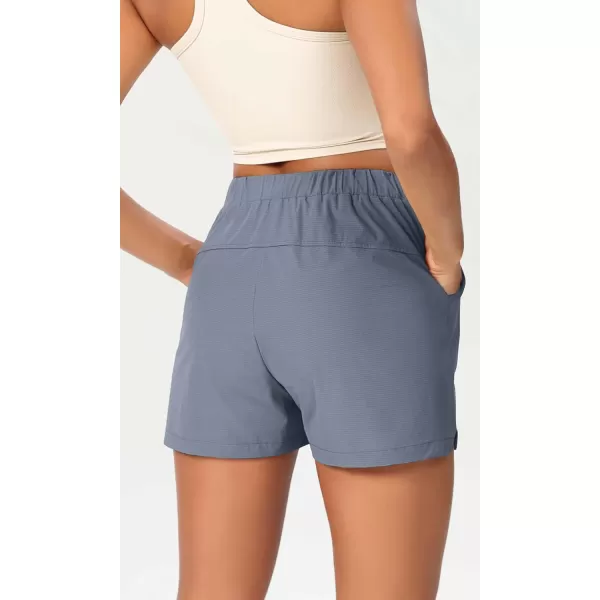 imageODODOS Stretch Woven Relaxed Shorts for Women Elastic High Waist Summer Lightweight Casual Shorts with PocketsBlue