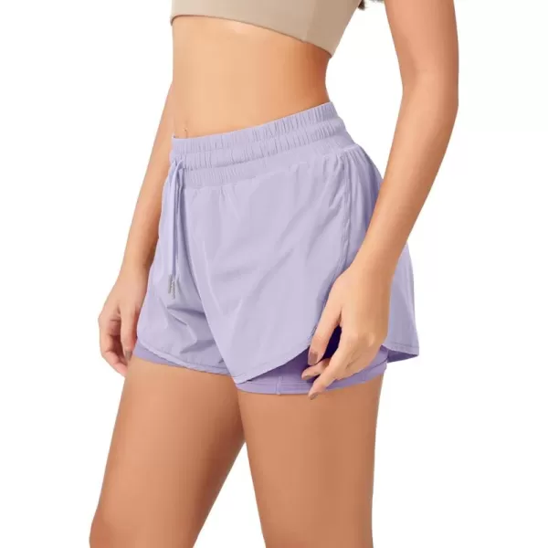 imageODODOS 2 in1 Athletic Shorts for Women High Waist Dolphin Split Workout Running Shorts with PocketsLight Purple