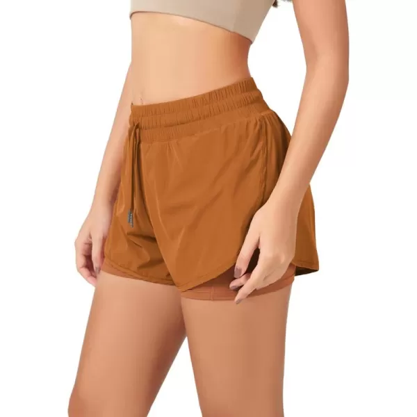 imageODODOS 2 in1 Athletic Shorts for Women High Waist Dolphin Split Workout Running Shorts with PocketsPeach Caramel