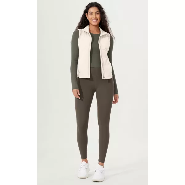 imageODODOS Womens Padded Vest with Pockets Athletic Stand Collar Sleeveless Warm Outerwear Zip Up GiletWhite