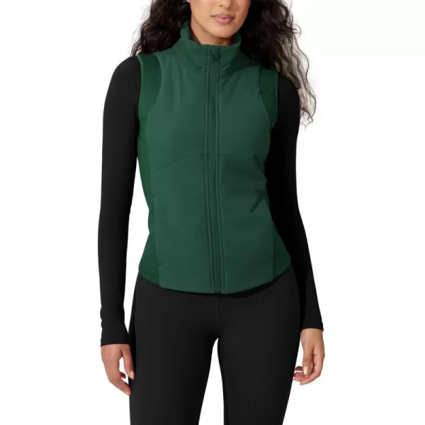 imageODODOS Womens Padded Vest with Pockets Athletic Stand Collar Sleeveless Warm Outerwear Zip Up GiletGreen