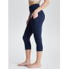 imageODODOS Womens High Waisted Yoga Capris with Pockets Tummy Control Non See Through Workout Athletic Running Capri LeggingsTie Dye Blue Navy
