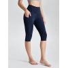 imageODODOS Womens High Waisted Yoga Capris with Pockets Tummy Control Non See Through Workout Athletic Running Capri LeggingsTie Dye Blue Navy