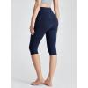 imageODODOS Womens High Waisted Yoga Capris with Pockets Tummy Control Non See Through Workout Athletic Running Capri LeggingsTie Dye Blue Navy