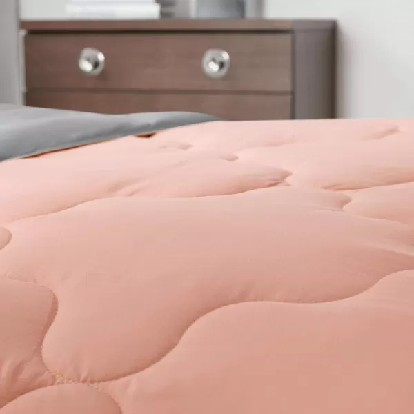 Comfort Spaces Vixie Reversible Comforter Set  Trendy Vibrant Color with Geometric Quilted Cover Lightweight All Season Down Alternative Cozy Bedding Sham NavyCharcoal TwinTwin XL 2 pieceCoralGray