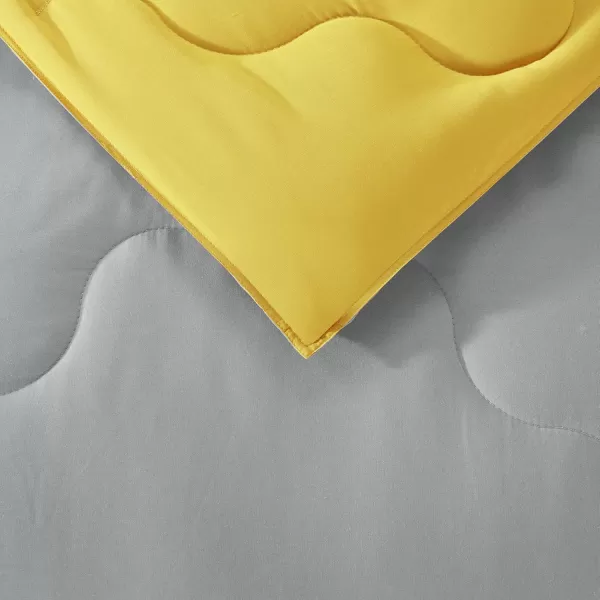 Comfort Spaces Vixie Reversible Comforter Set  Trendy Vibrant Color with Geometric Quilted Cover Lightweight All Season Down Alternative Cozy Bedding Sham NavyCharcoal TwinTwin XL 2 pieceGreyYellow