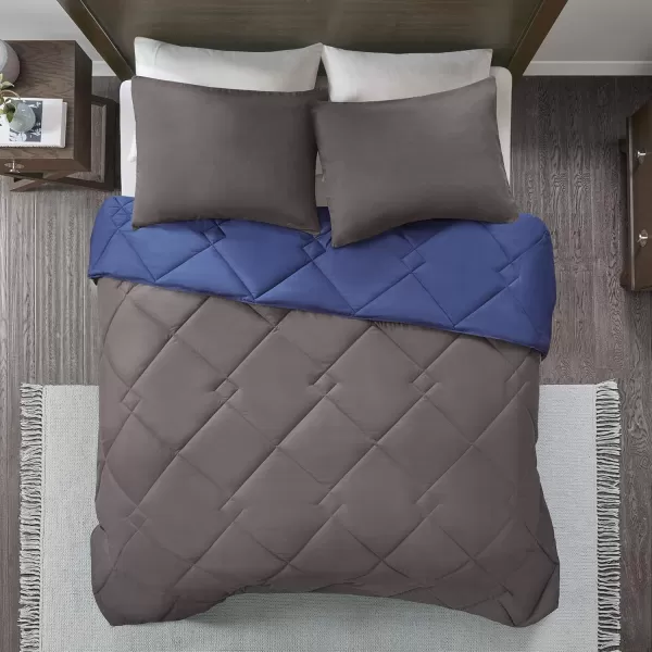 Comfort Spaces Vixie Reversible Comforter Set  Trendy Vibrant Color with Geometric Quilted Cover Lightweight All Season Down Alternative Cozy Bedding Sham NavyCharcoal TwinTwin XL 2 pieceNavyCharcoal