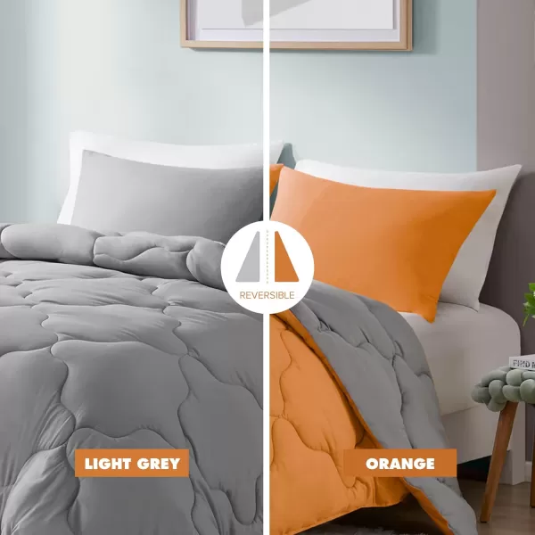 Comfort Spaces Vixie Reversible Comforter Set  Trendy Vibrant Color with Geometric Quilted Cover Lightweight All Season Down Alternative Cozy Bedding Sham NavyCharcoal TwinTwin XL 2 pieceOrangeGrey