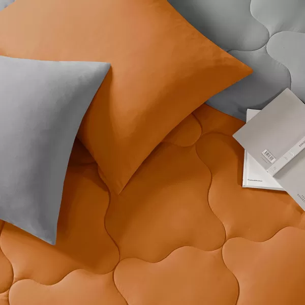 Comfort Spaces Vixie Reversible Comforter Set  Trendy Vibrant Color with Geometric Quilted Cover Lightweight All Season Down Alternative Cozy Bedding Sham NavyCharcoal TwinTwin XL 2 pieceOrangeGrey