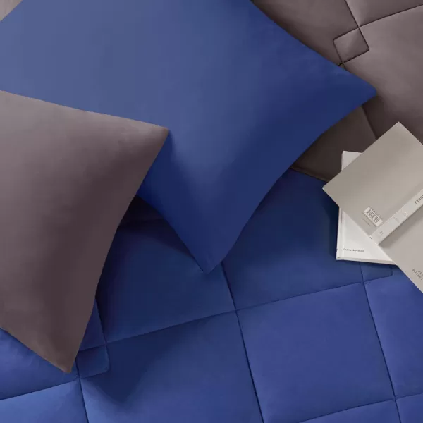 Comfort Spaces Vixie Reversible Comforter Set  Trendy Vibrant Color with Geometric Quilted Cover Lightweight All Season Down Alternative Cozy Bedding Sham NavyCharcoal TwinTwin XL 2 pieceNavyCharcoal