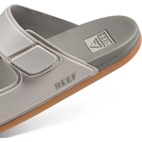 imageREEF Cushion Tradewind Mens Fashion Slides Adjustable Velcro Straps Ultra Soft Cushion Footbed Arch SupportDoveTobacco