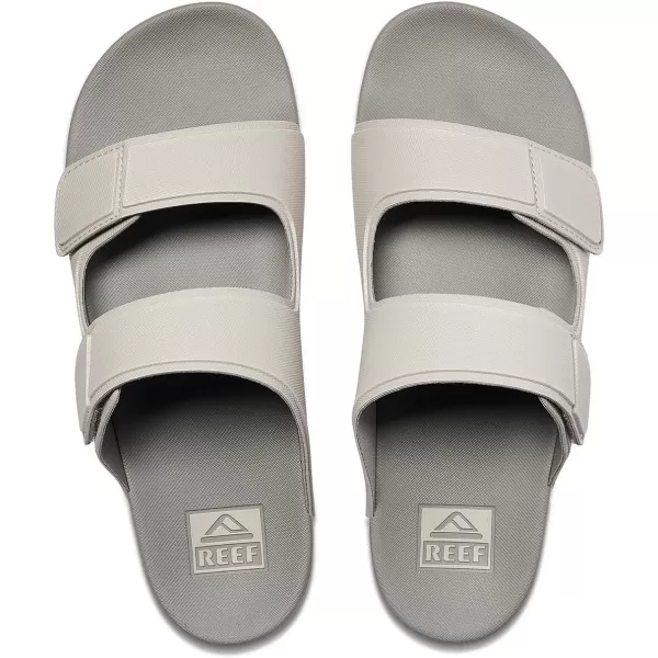 imageREEF Cushion Tradewind Mens Fashion Slides Adjustable Velcro Straps Ultra Soft Cushion Footbed Arch SupportDoveTobacco