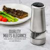 imageOVENTE 2 in 1 Stainless Steel Sea Salt and Pepper Grinder with Ceramic Blade Automatic One Hand Operation ampamp Battery Operated Salt ampamp Pepper Mill Easy Grinding Adjustable Coarseness Silver SPD121S