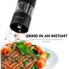 imageOVENTE Set of 2 Electric Salt ampamp Pepper Mill Grinder Battery Powered Stainless Steel Blades Automatic One Handed Operation with light and Adjustable Coarseness Black and White SPD102BW