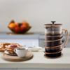 imageOVENTE French Press Coffee Maker 20 Ounce 4 Level Stainless Steel Filter System ampamp Heat Resistant Borosilicate Glass Scoop Included Copper FSF20CFSW34C