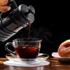 imageOVENTE French Press Coffee Maker 34 Ounce Heat Resistant Borosilicate Glass with 4 Filter StainlessSteel System BPAFree Portable Pitcher Perfect for Hot ampamp Cold Brew Red FPT34RFPW  Black